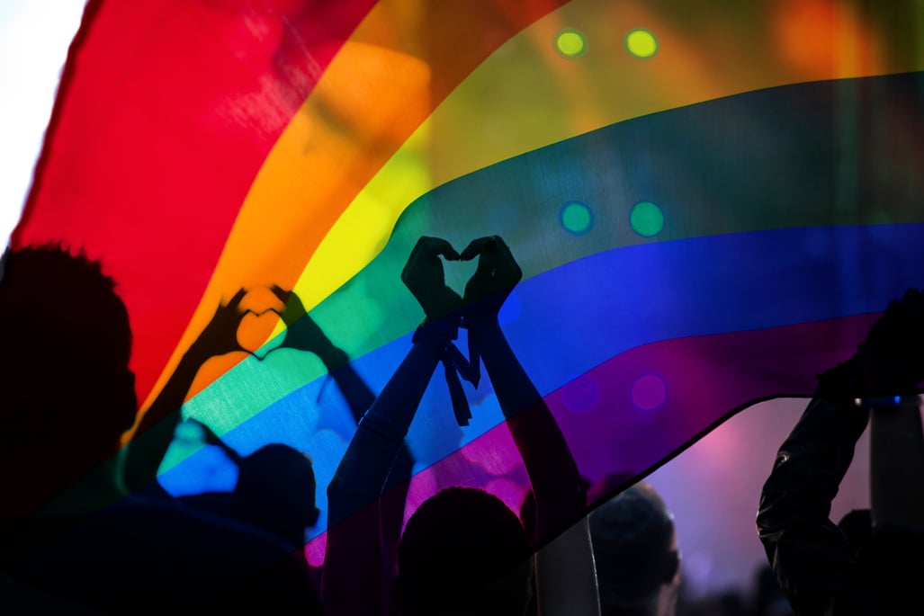 Gay parade with LGBT flag.